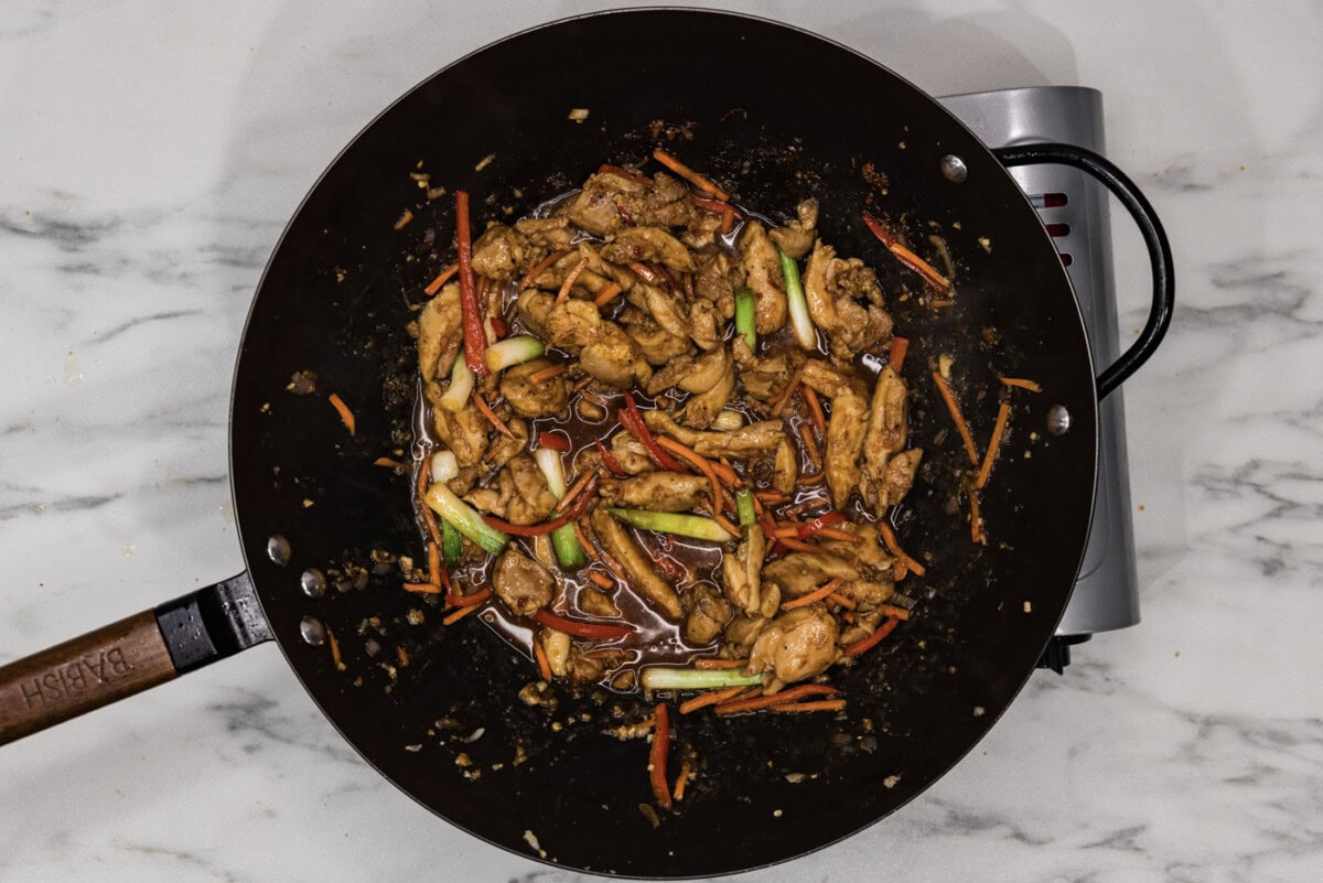 overhead photo of cooked Szechuan chicken in a wok