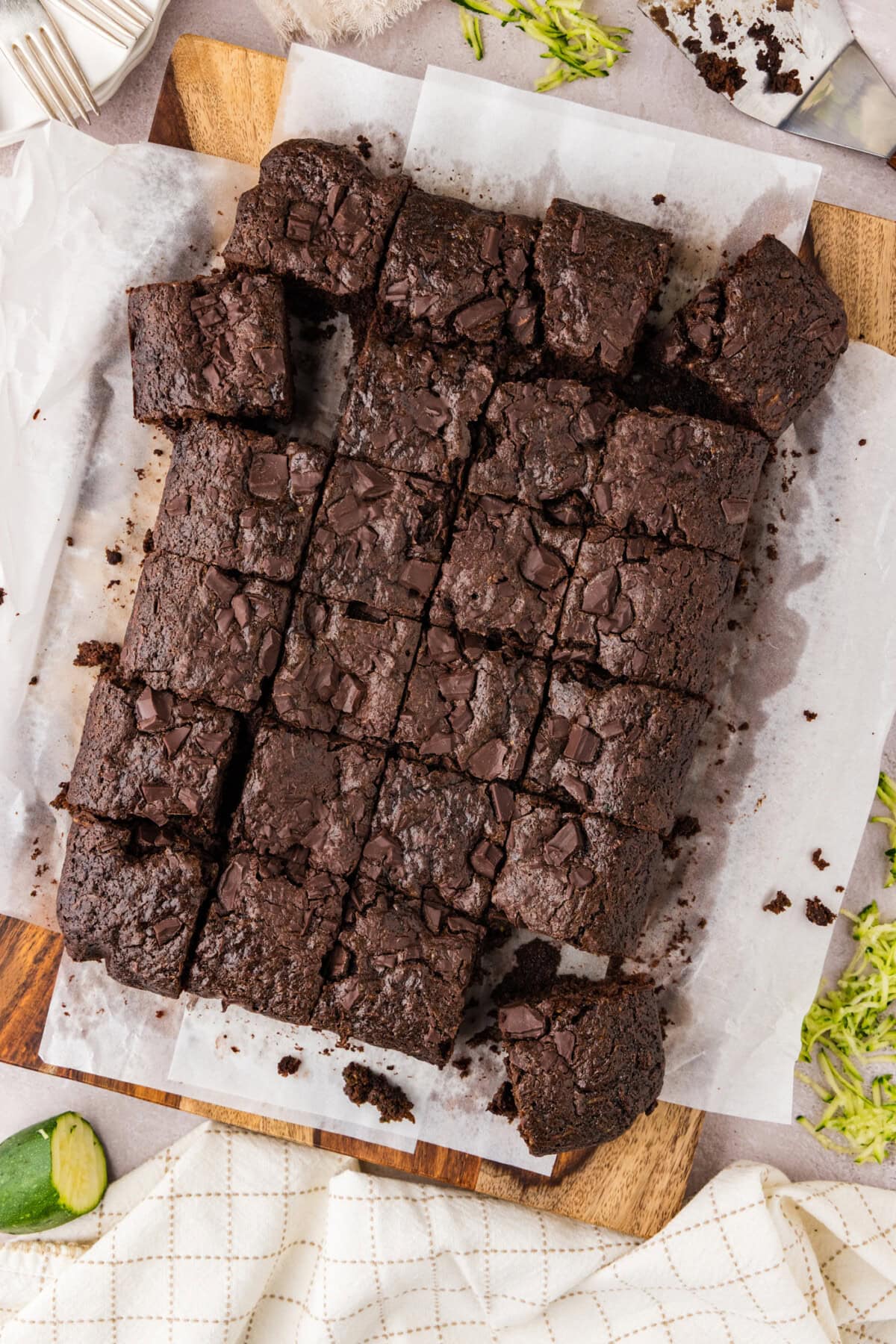 Zucchini Brownies cut into squares on parchment paper