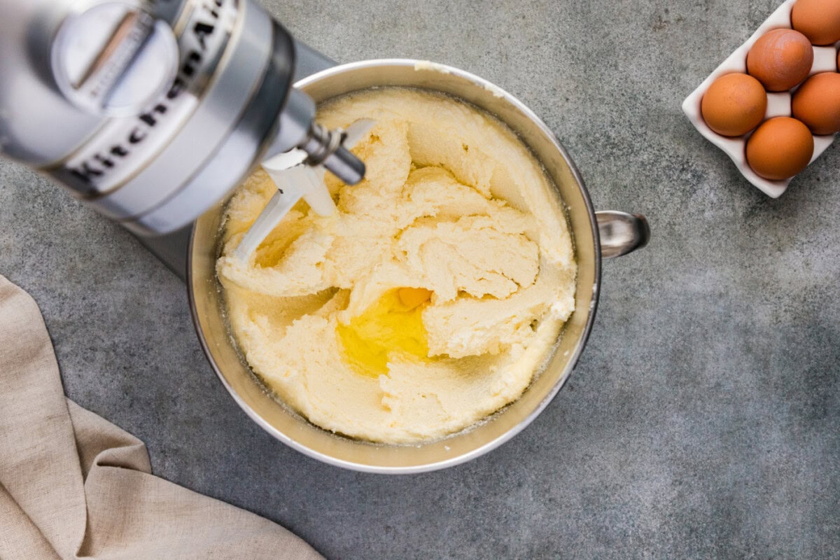 Adding egg to butter and shortening mixture in a stand mixer bowl