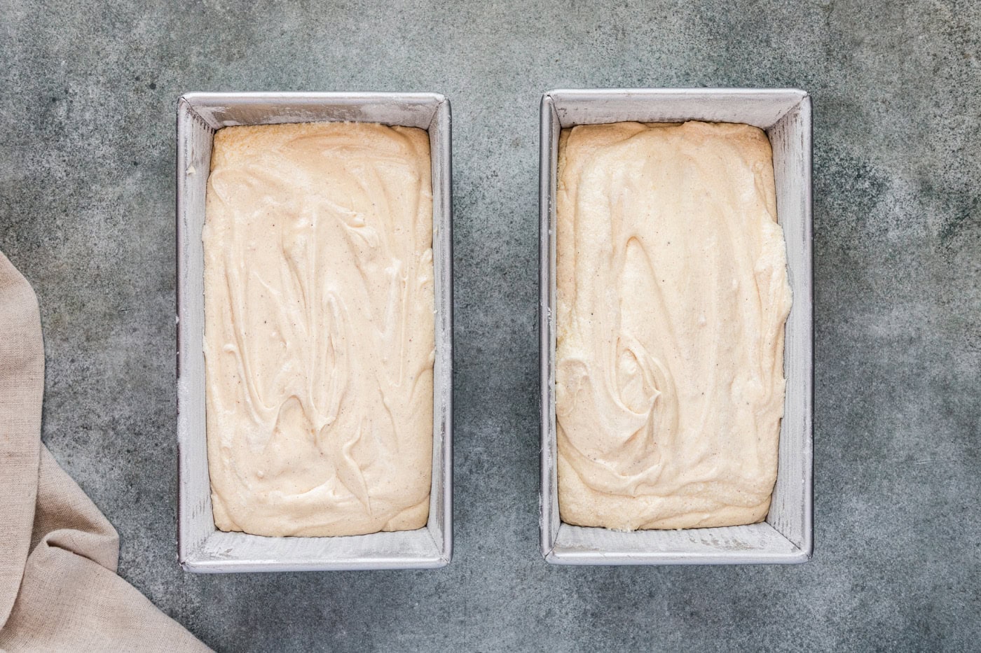 apple cider pound cake batter in loaf pans
