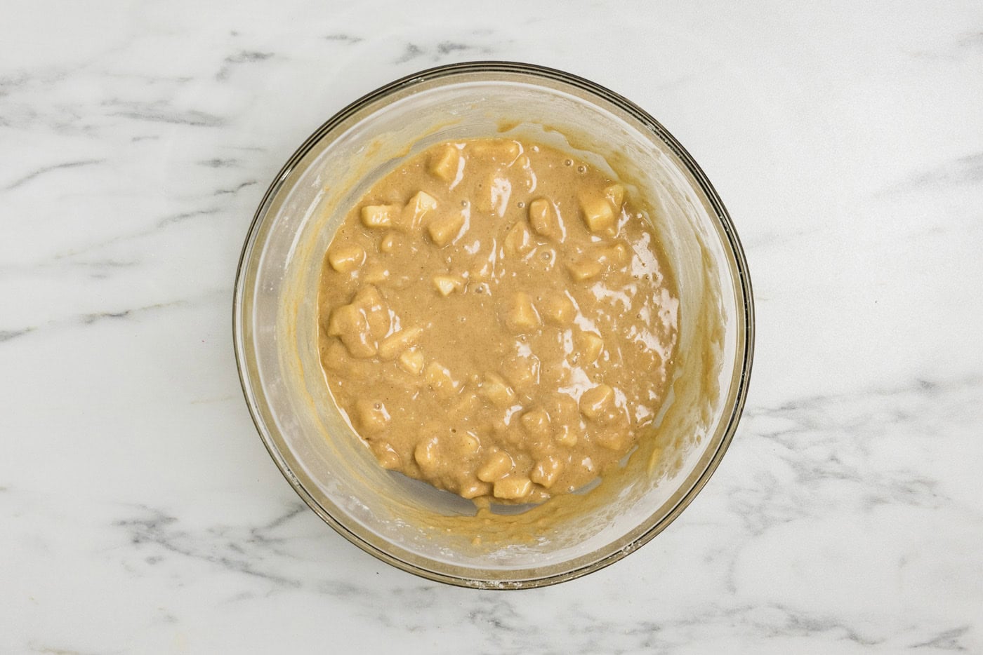 Apple muffin batter in a bowl