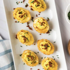 Close up photo of Fried Deviled Eggs on a white platter