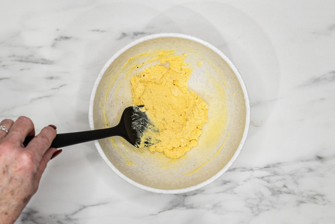 deviled eggs filling mixed together in a bowl
