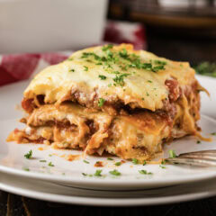 Close up photo of a serving of Italian Lasagna on a plate