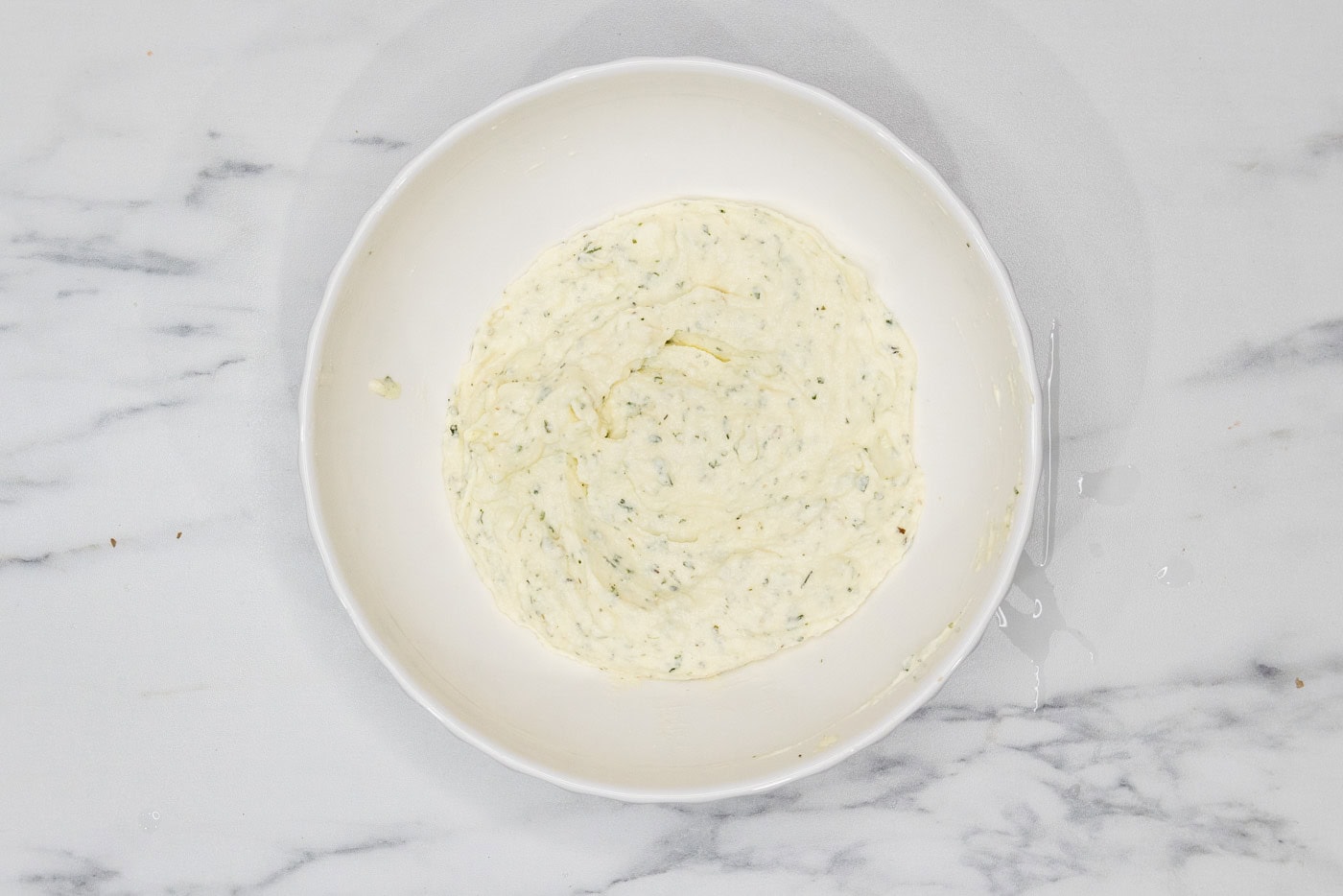 ricotta mixture for lasagna mixed together in a bowl