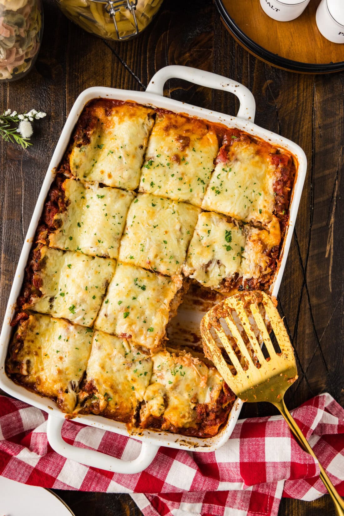 Pan of Italian Lasagna cut into squares with a slice removed
