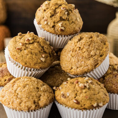 Close up photo of a pile of Pumpkin Banana Muffins