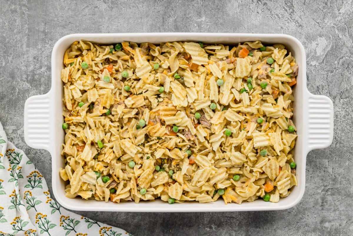 crushed potato chips on top of tuna casserole in a baking dish