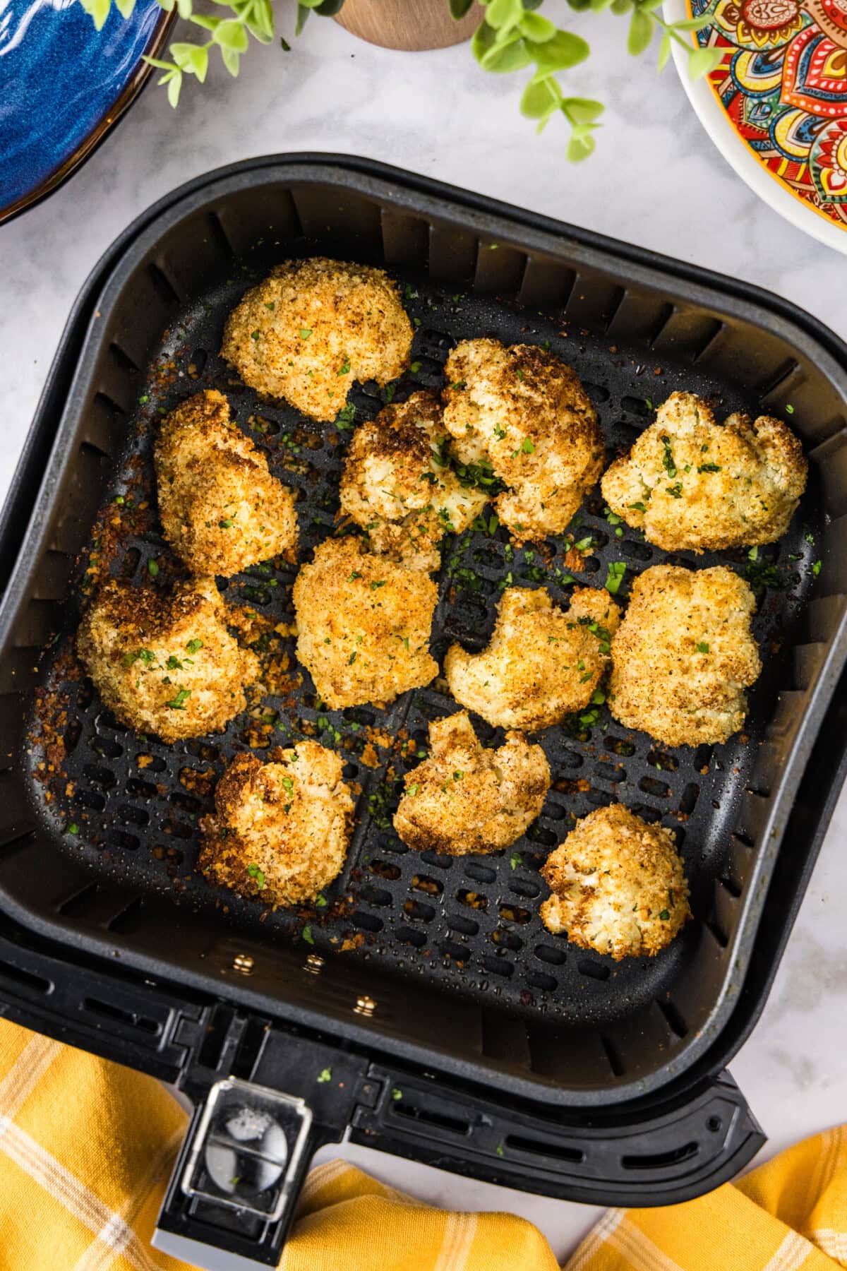 Air fryer basket of Air Fryer Fried Cauliflower