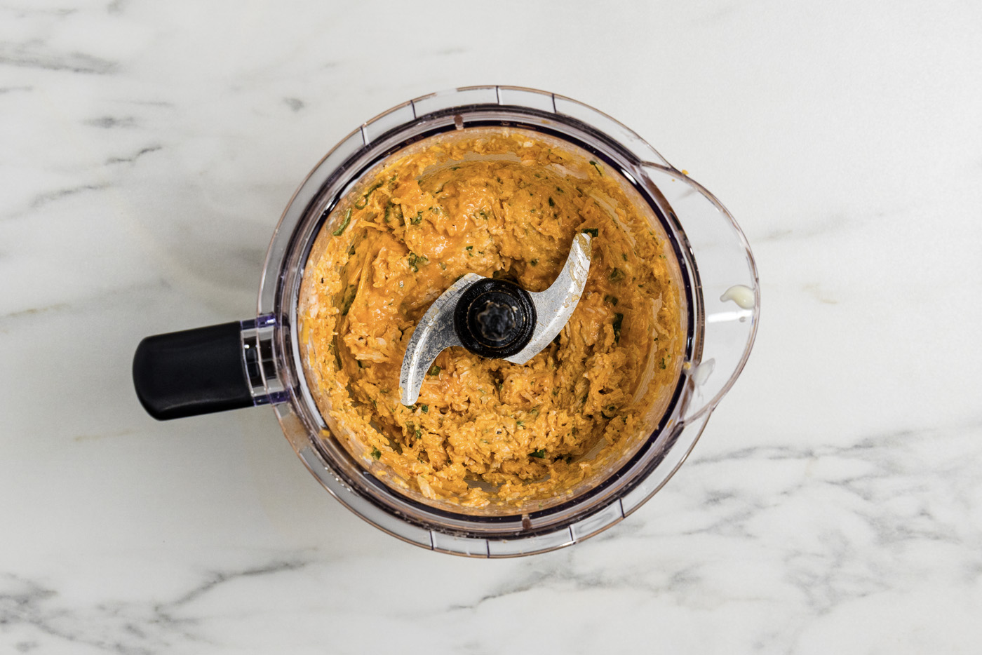 buffalo chicken mixture in a food chopper