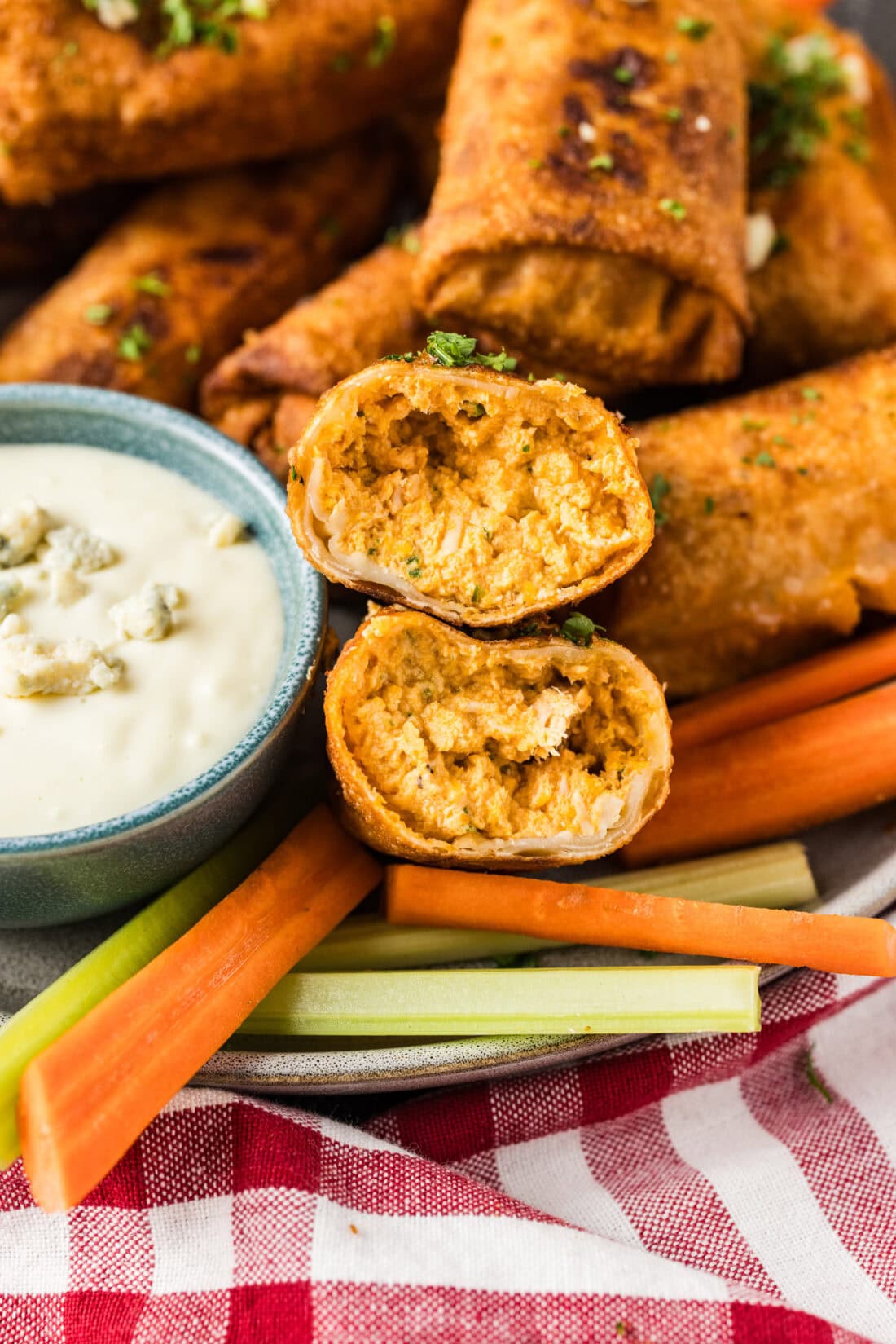 Close up photo of a Buffalo Chicken Egg Roll cut in half