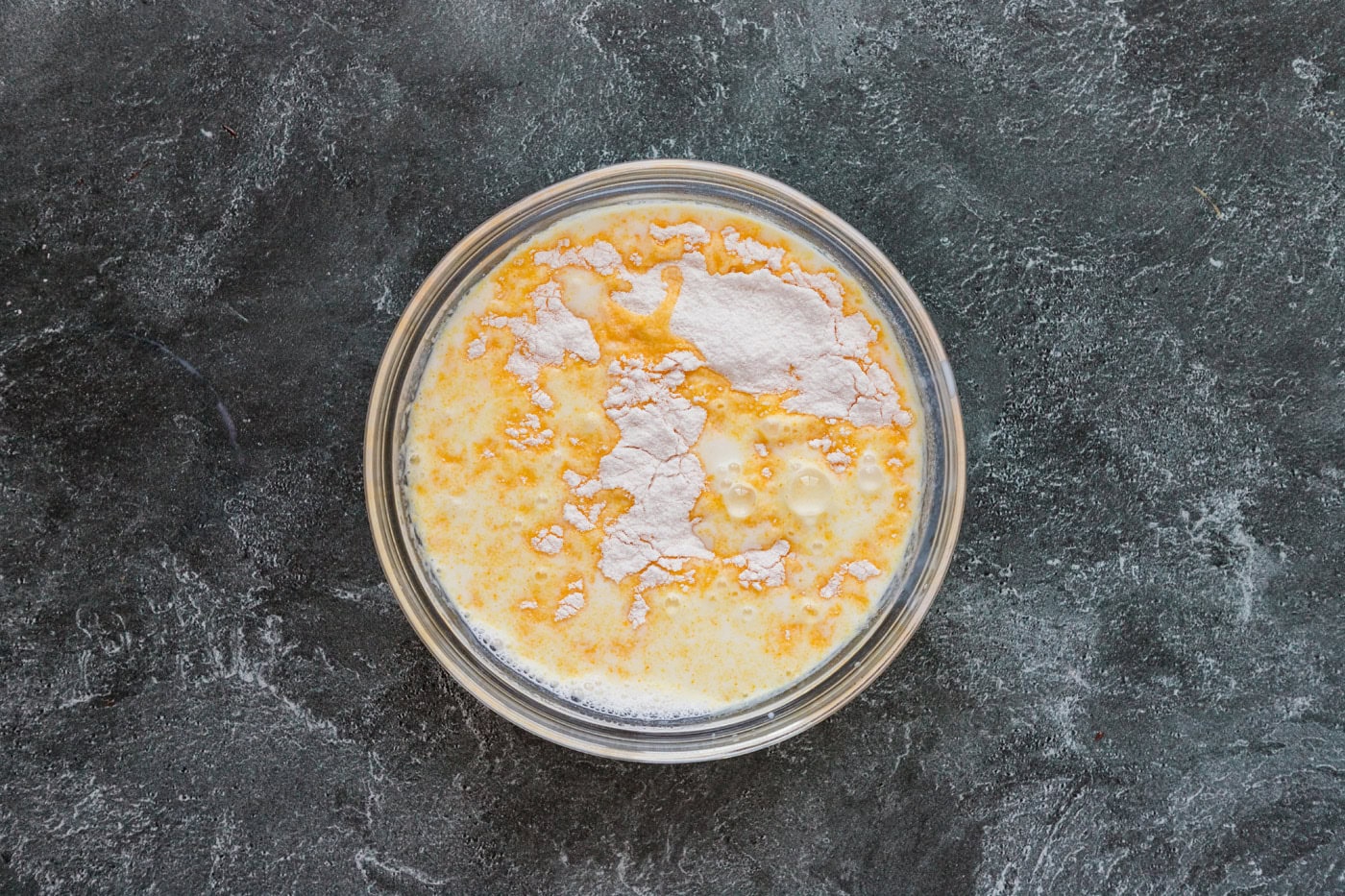 instant pudding mix in a bowl with. milk