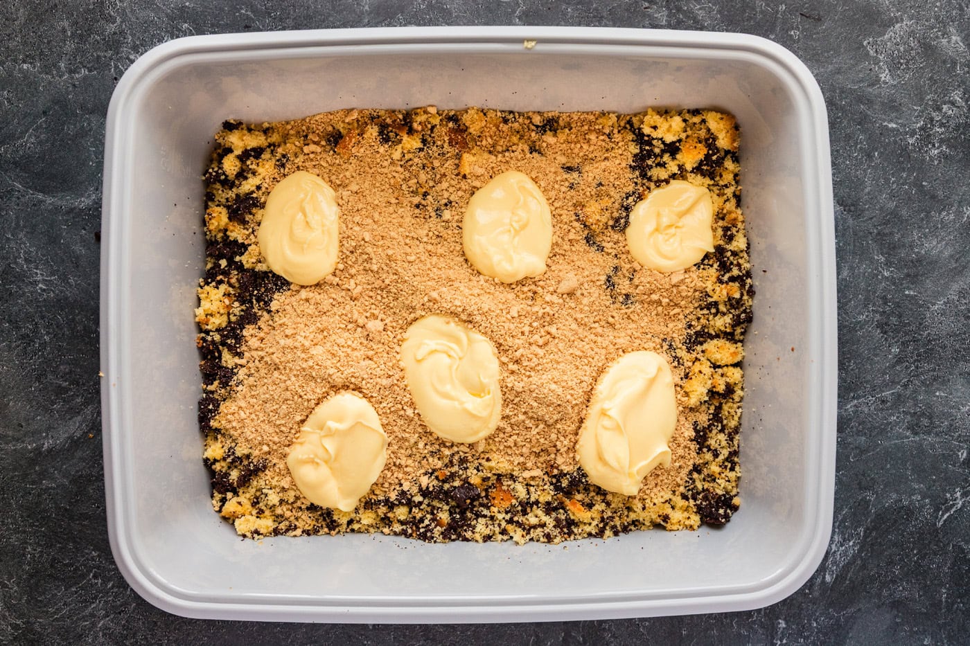 pudding added on top of crushed Oreos and cake