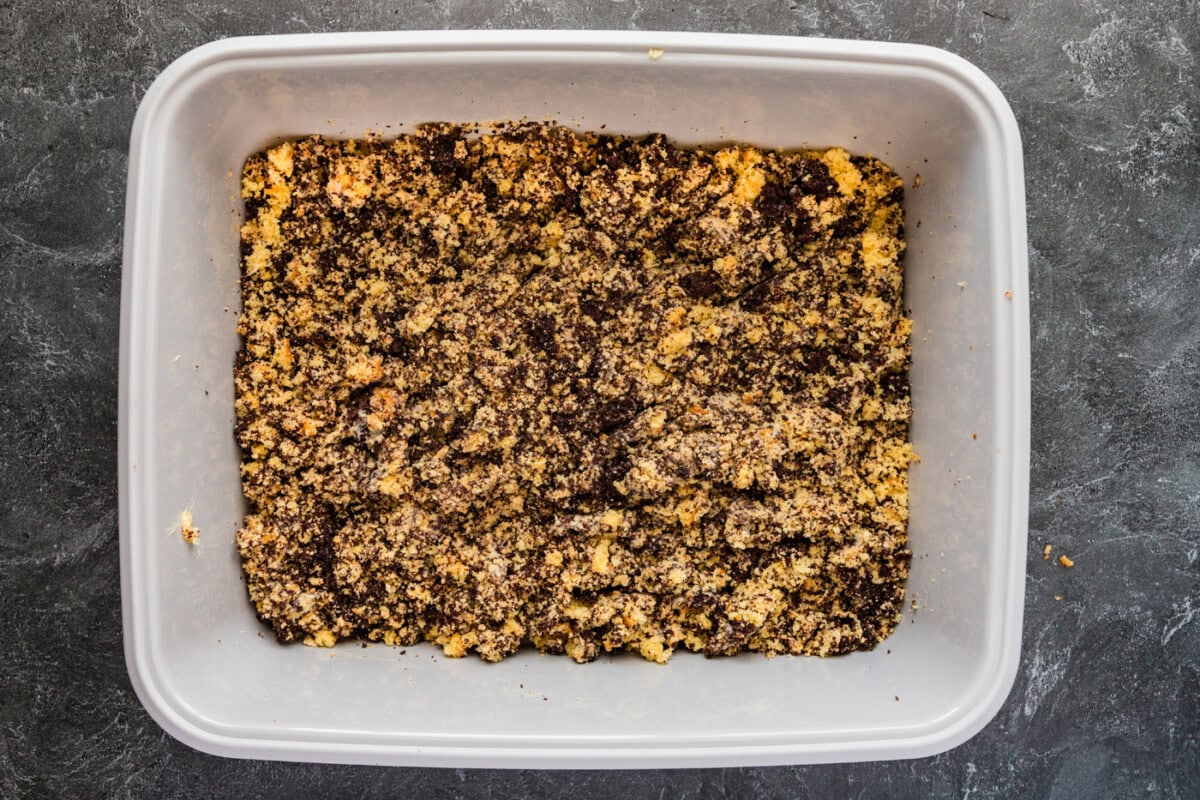cake, crushed cookies, and pudding mixed together in a cat litter pan