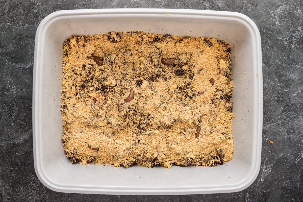 crushed cookies added over cake mixture