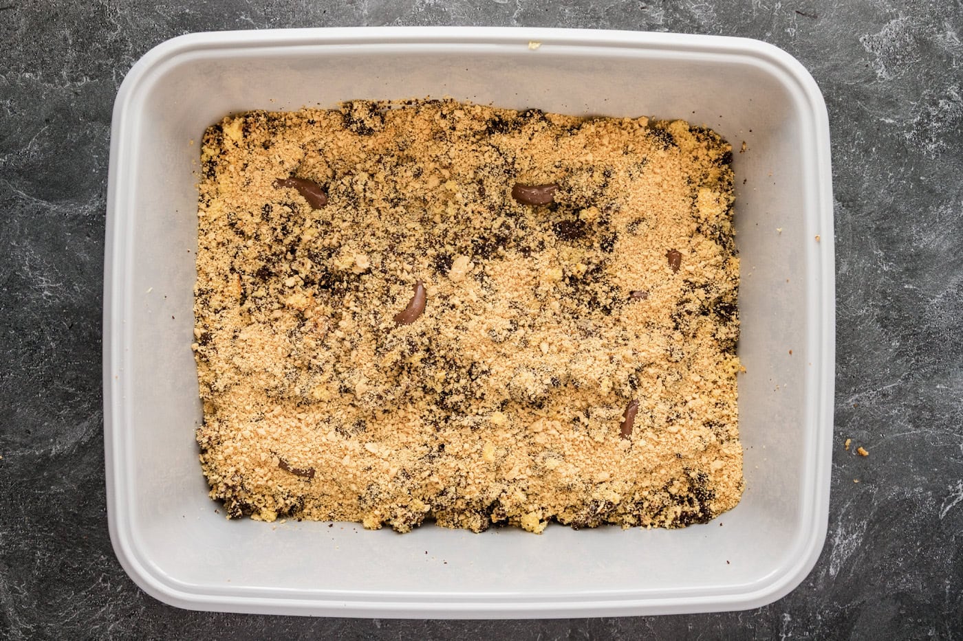 crushed cookies added over cake mixture