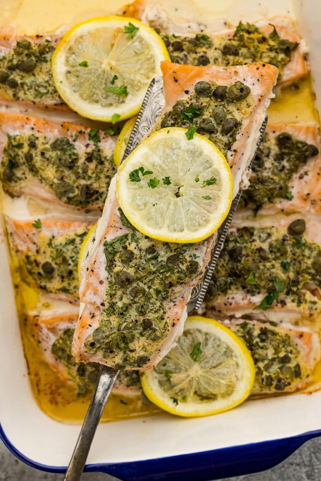 Spatula lifting up a Lemon Caper Salmon filet