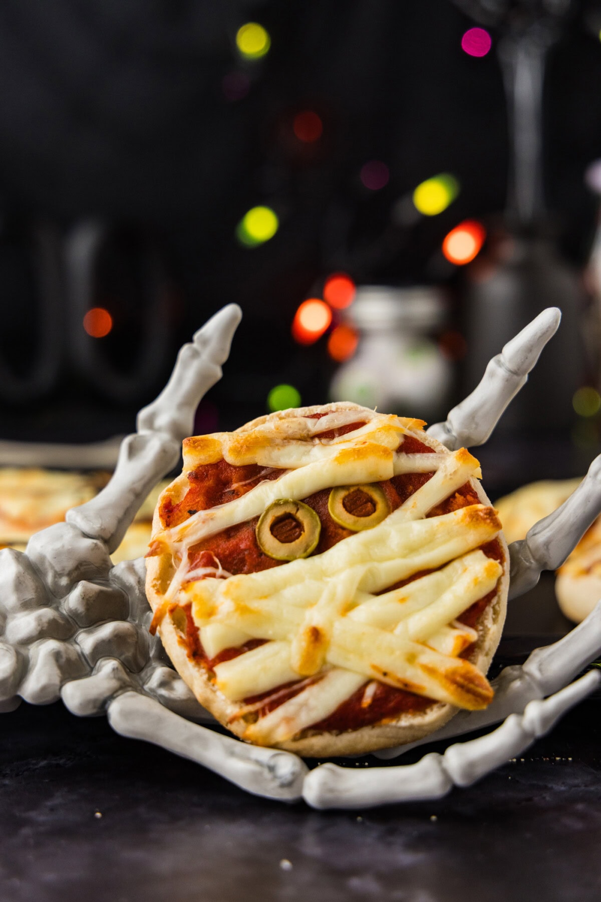 Mini Mummy Pizza in a skeleton hand