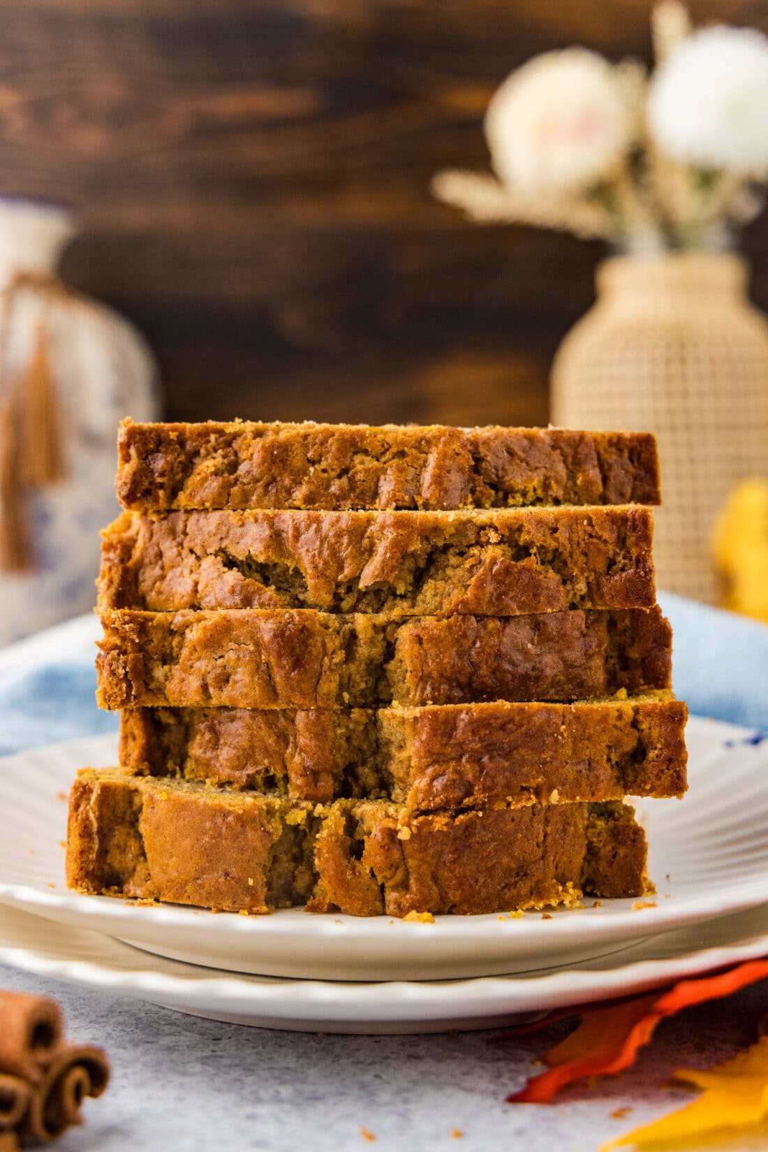 Stack of Pumpkin Banana Bread slices on a plate