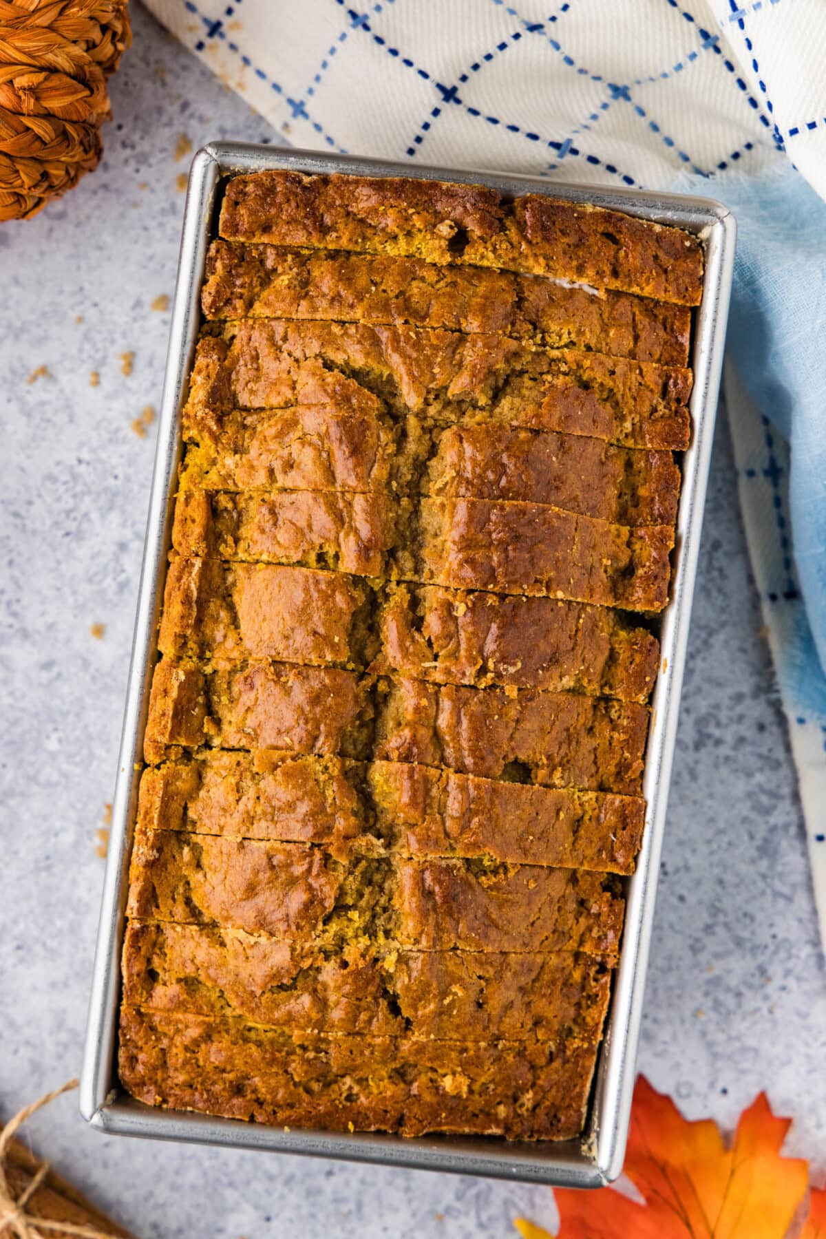 Pumpkin Banana Bread cut into slices in a loaf pan