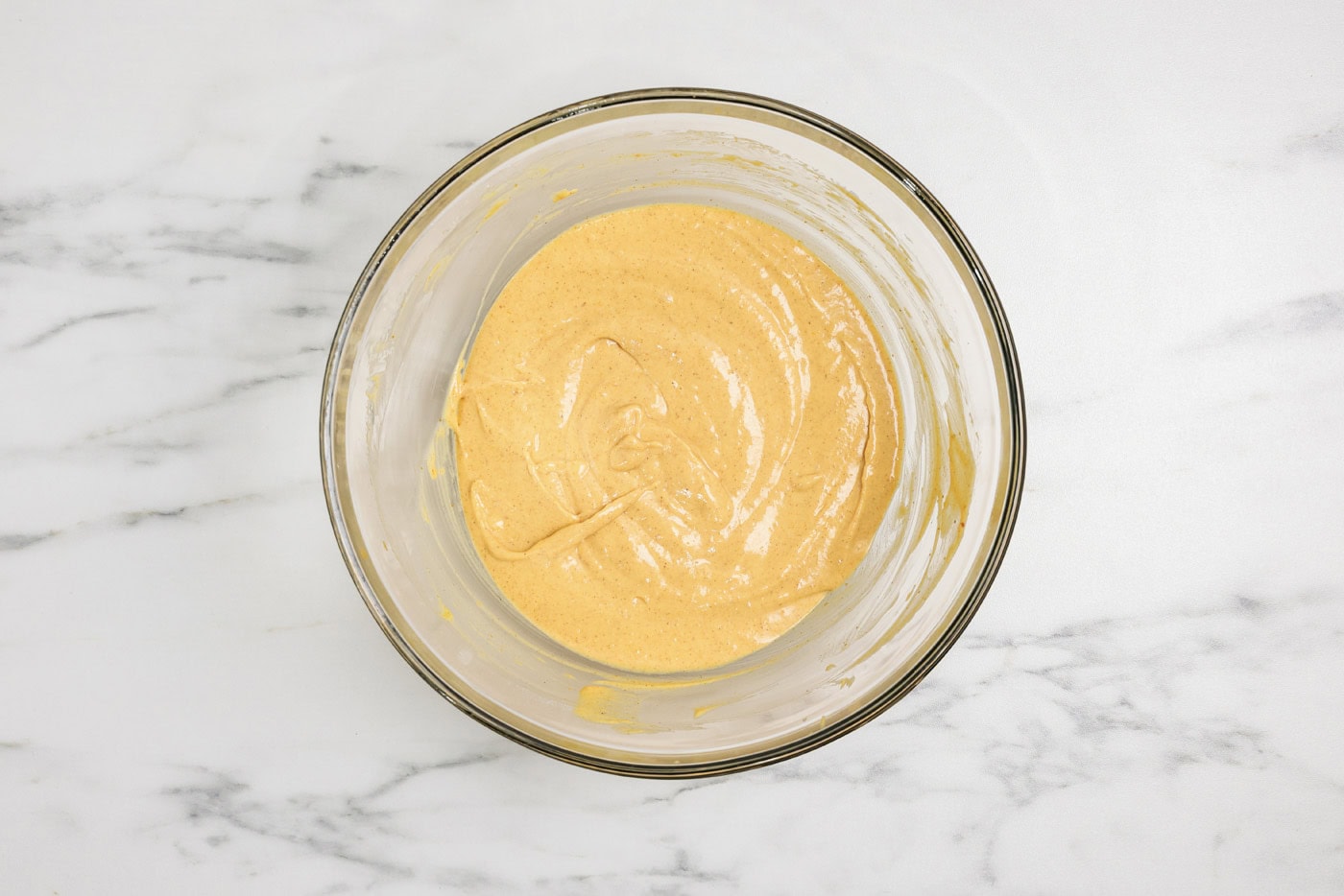 pumpkin cheesecake batter in a mixing bowl