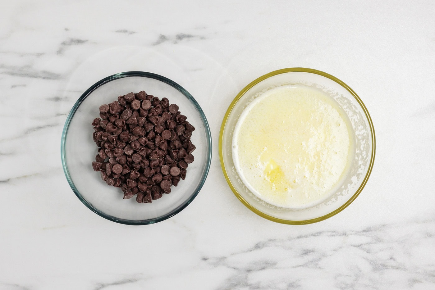 bowl of melted butter and a bowl of chocolate chips
