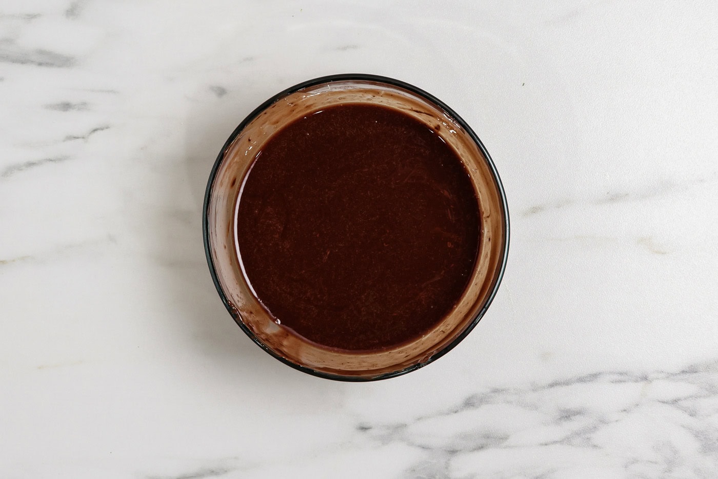 melted chocolate and butter mixture in a bowl