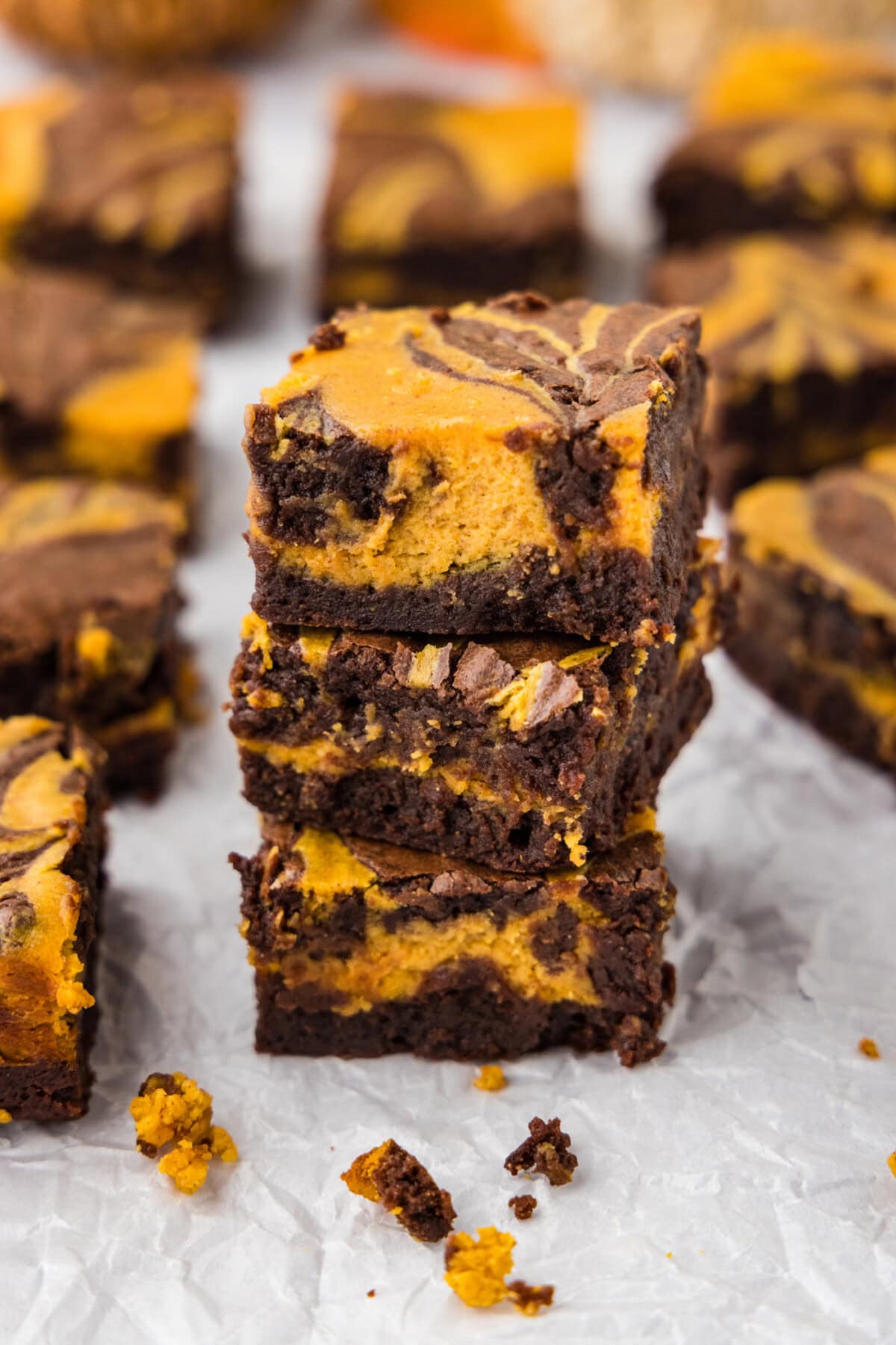 Stack of three Pumpkin Cheesecake Brownies