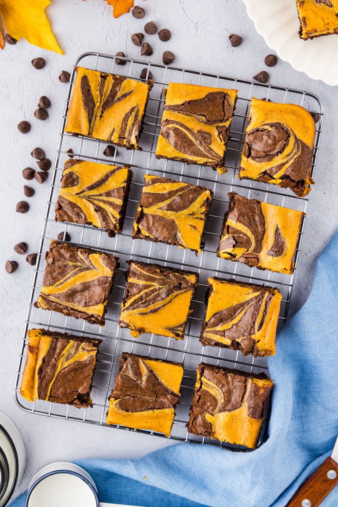 Pumpkin Cheesecake Brownies on a wire rack