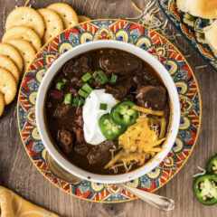 Bowl of Short Rib Chili with crackers on the side
