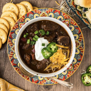 Bowl of Short Rib Chili with crackers on the side