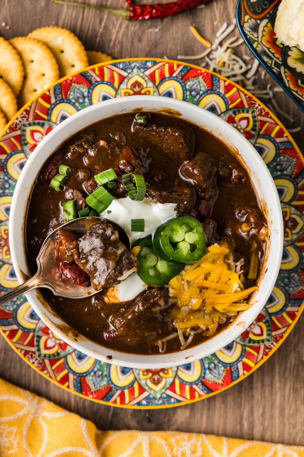 Bowl of Short Rib Chili with a spoon in it