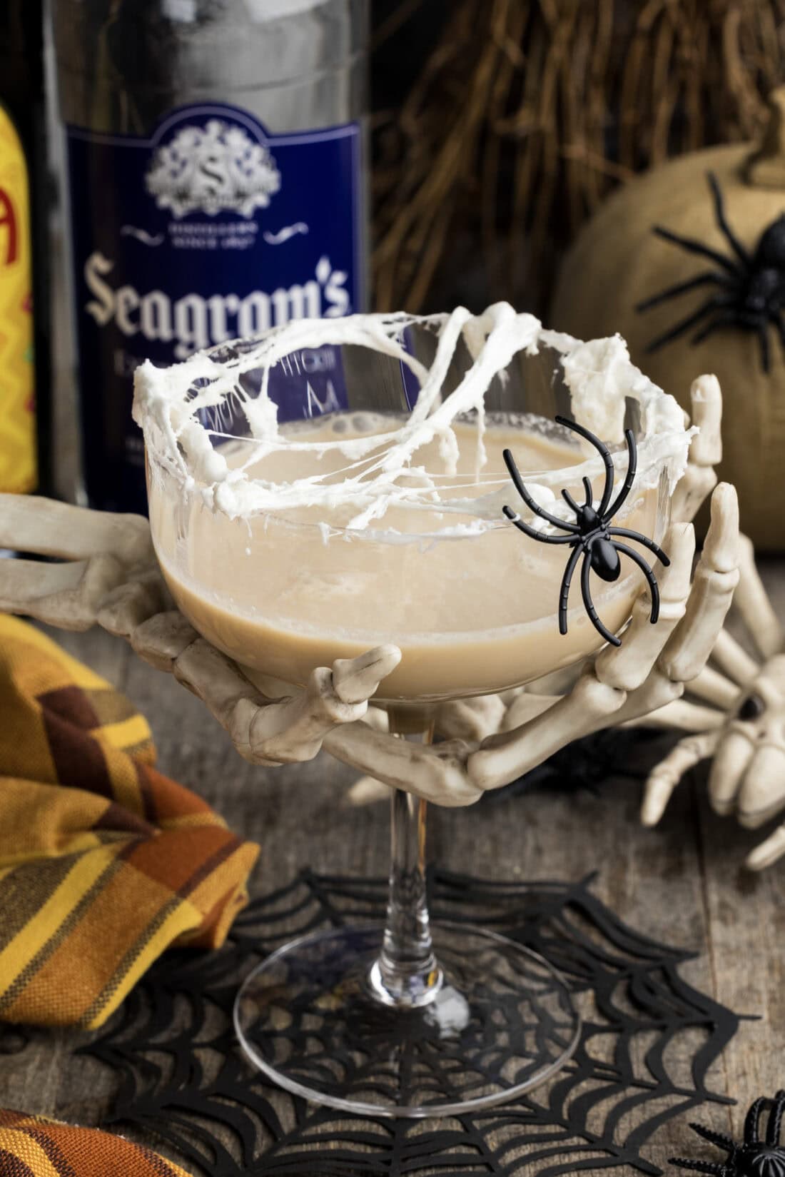 Skeleton hand holding a Spiderweb Cocktail