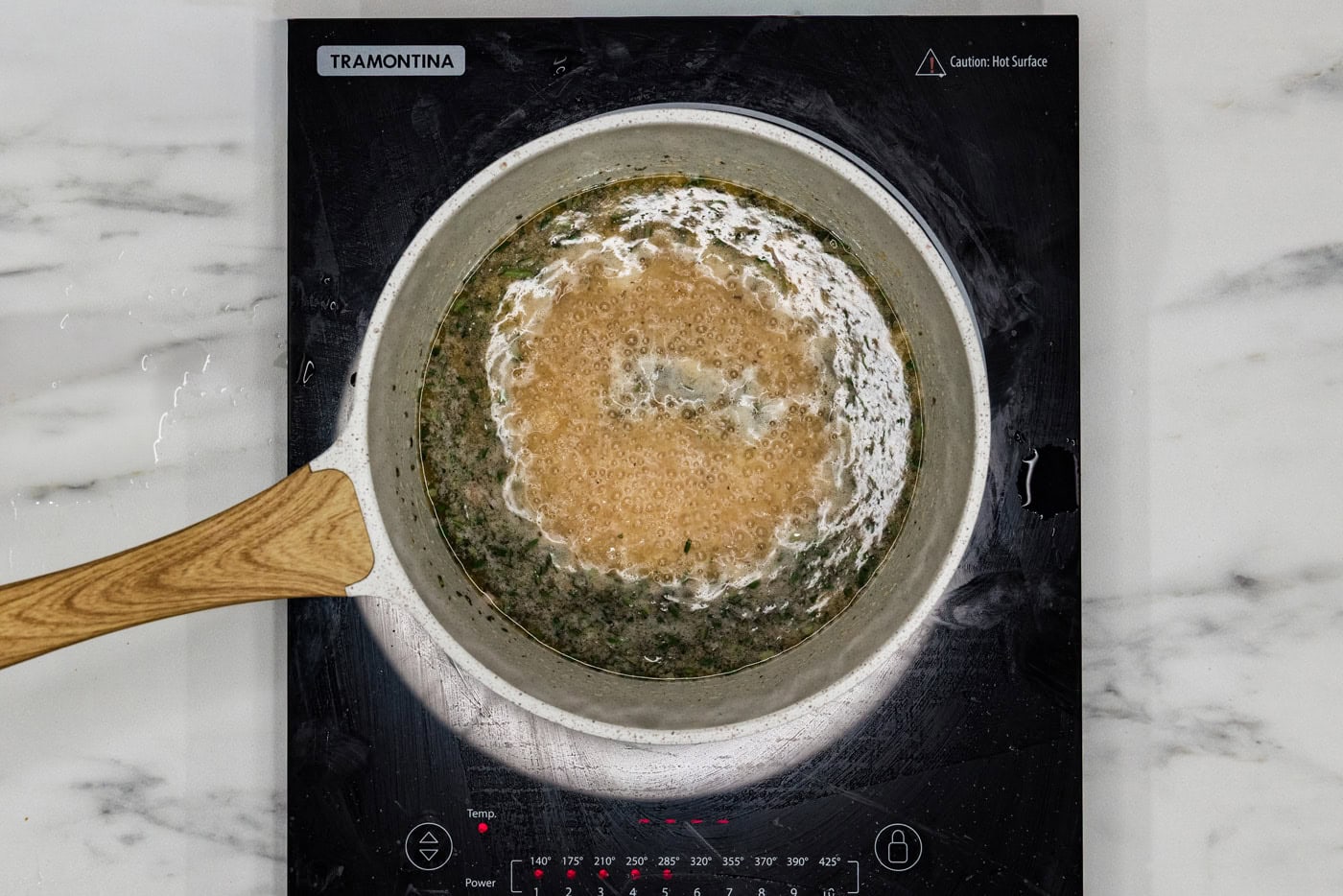 chilean sea bass sauce in a pot