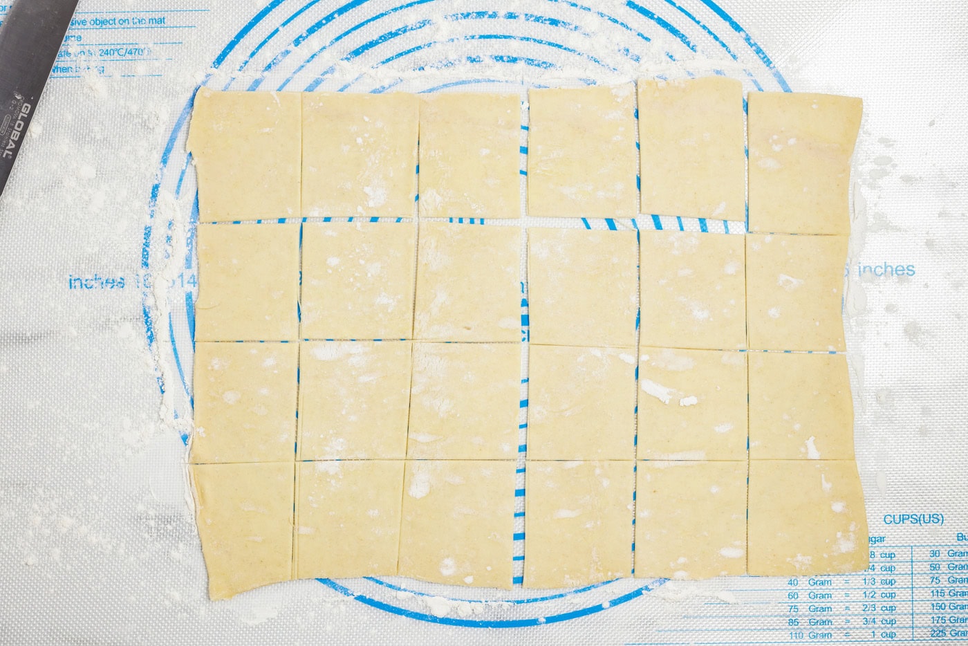 puff pastry sheet on a floured surface cut into squares