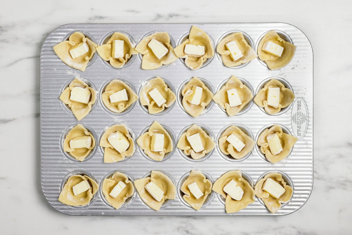 cubes of brie inside puff pastry squares