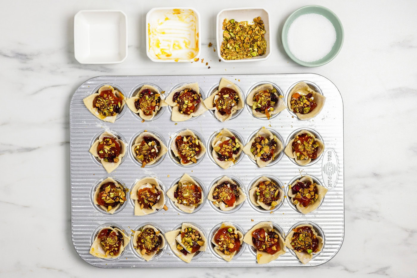 chopped pistachios added on top of brie bites