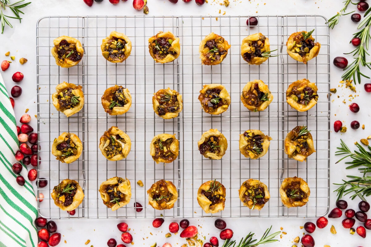 overhead photo of baked brie bites on a wire cooling rack