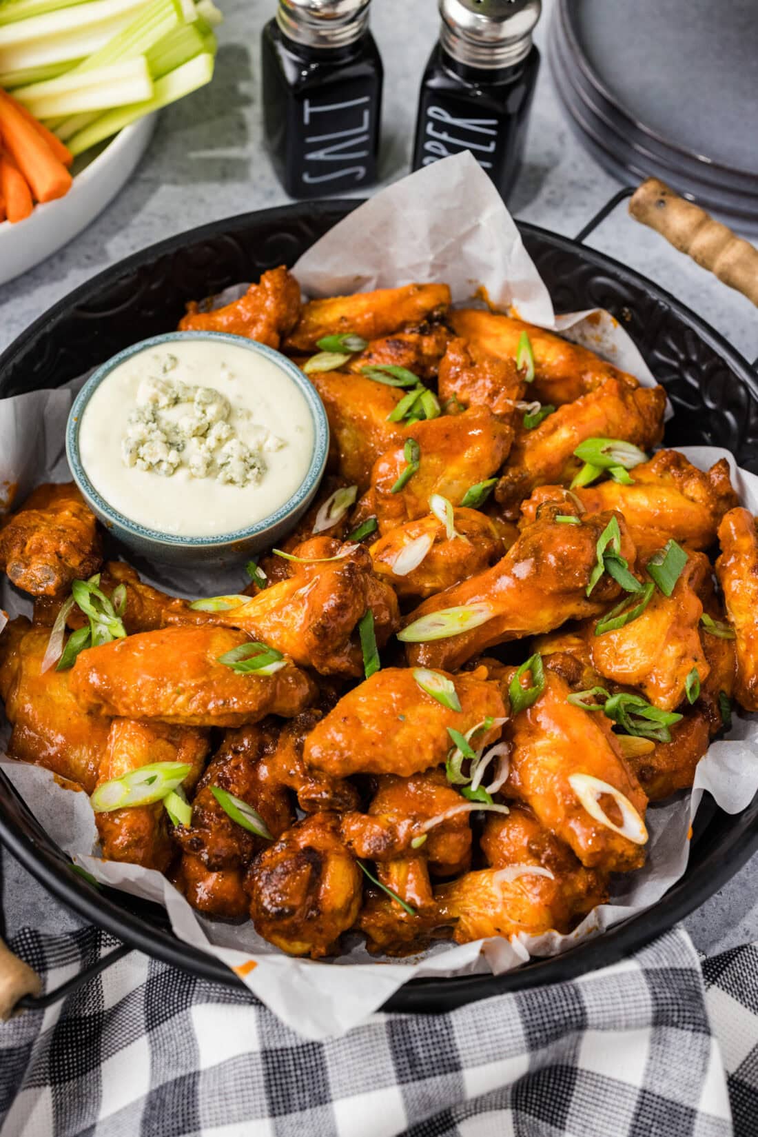 Platter of Buffalo Chicken Wings with a bowl of blue cheese to the side