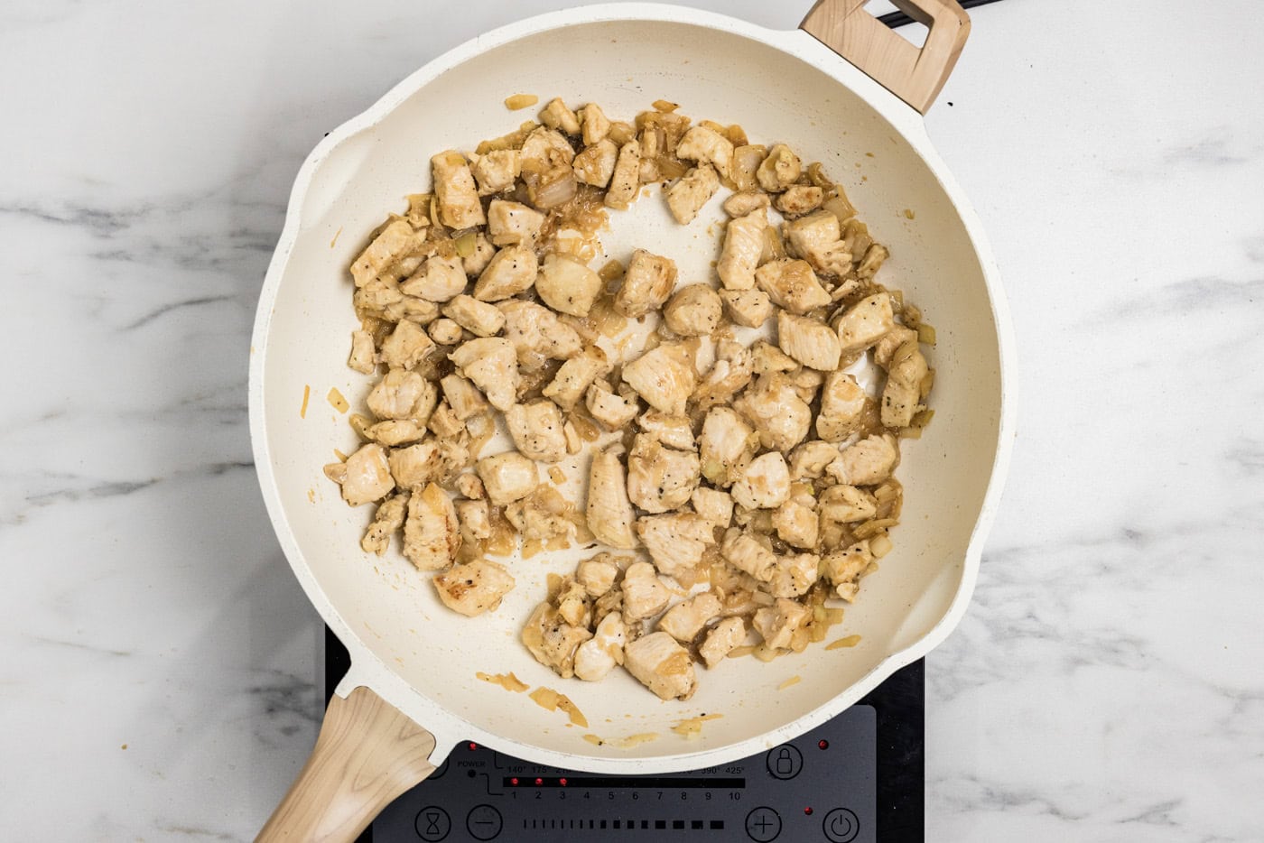 chicken cubes cooked in a skillet