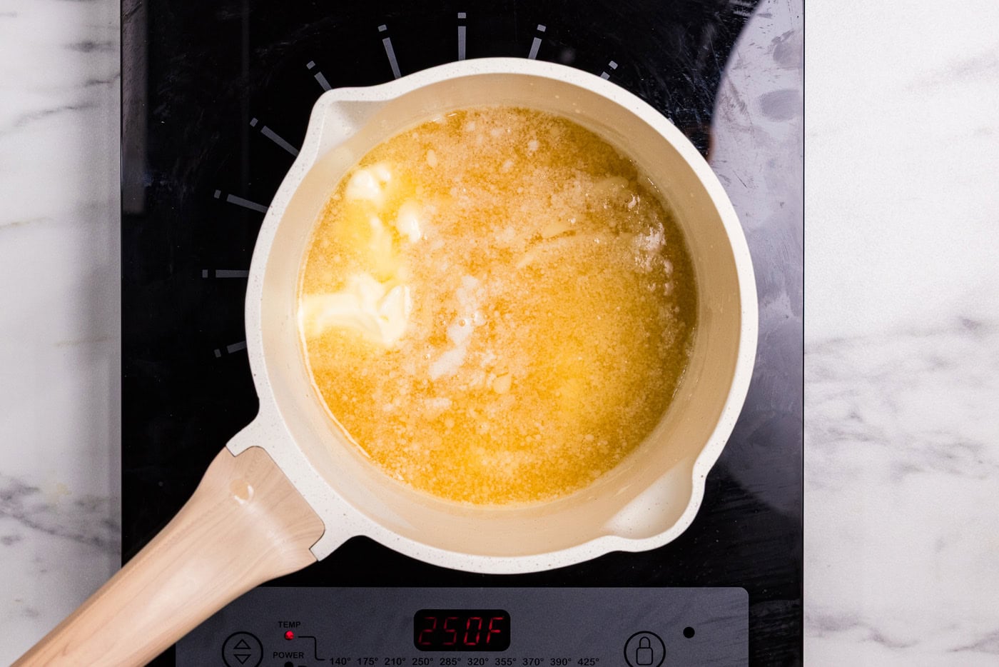 melted butter with bourbon in a saucepan