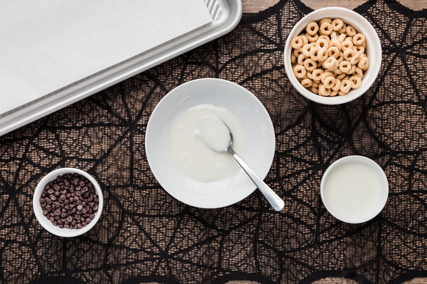 powdered sugar and milk glaze in a bowl with a spoon