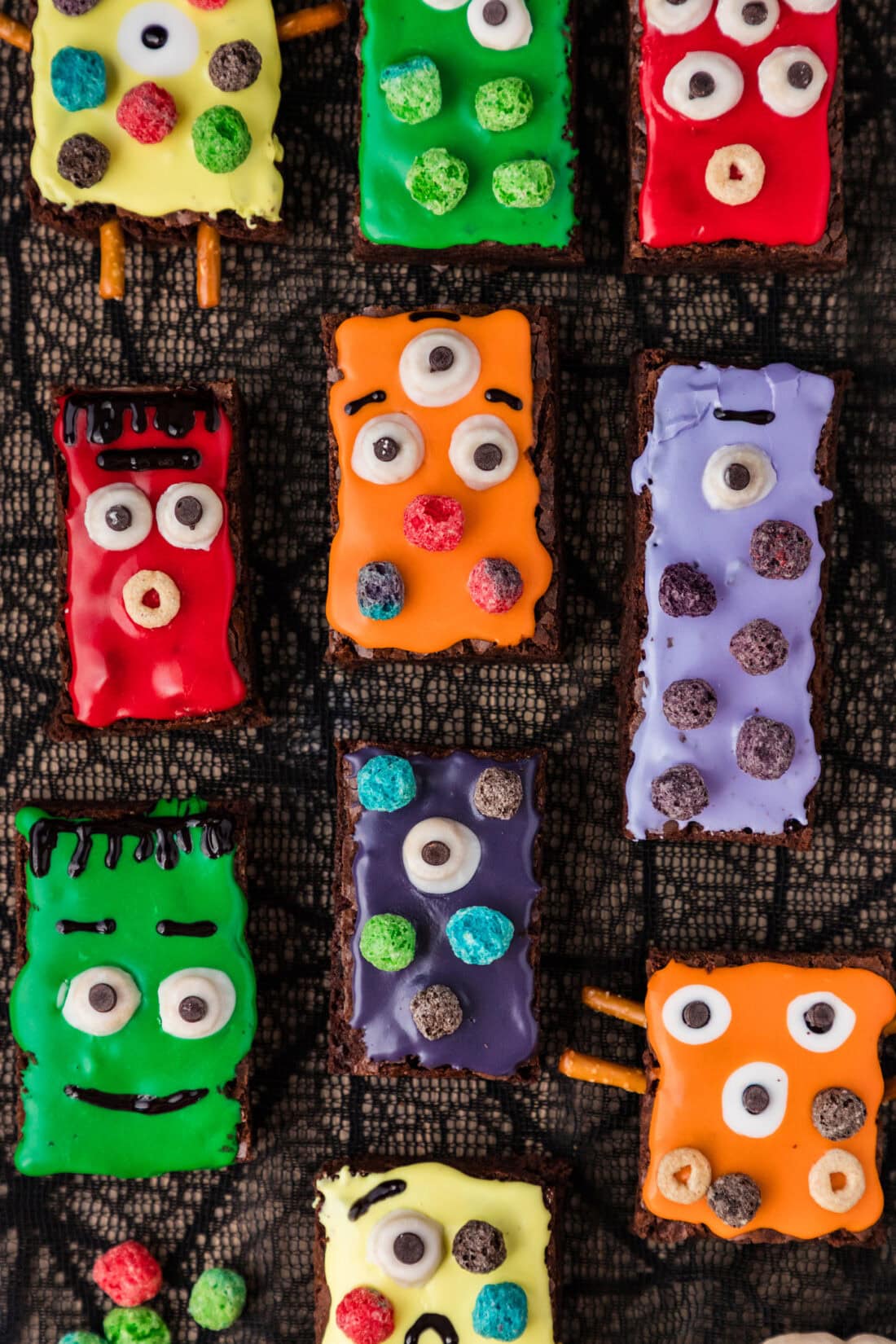 Monster Brownies resting on a spiderweb tablecloth