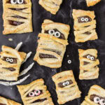 Mummy Hand Pies with one resting in a skeleton hand