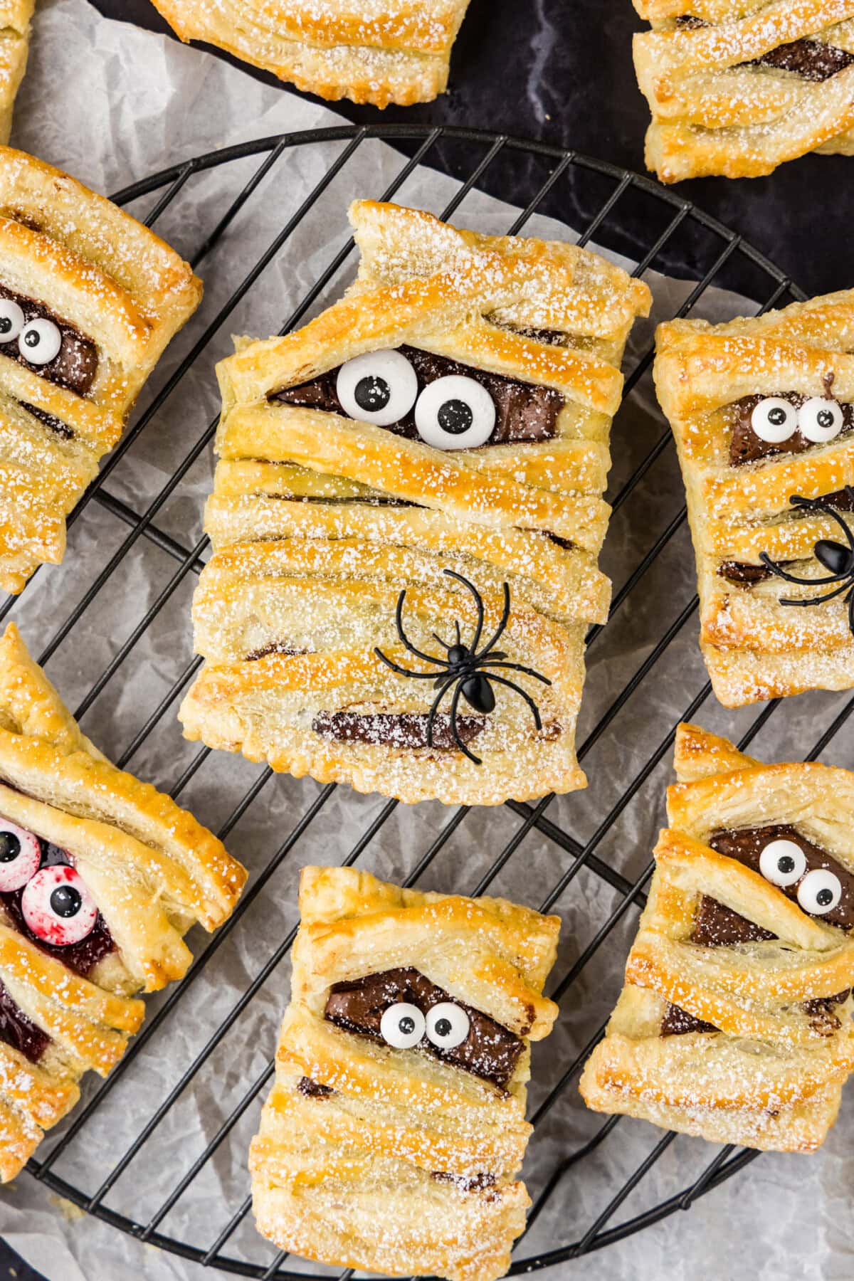 Close up photo of Mummy Hand Pies with a bite taken out of one