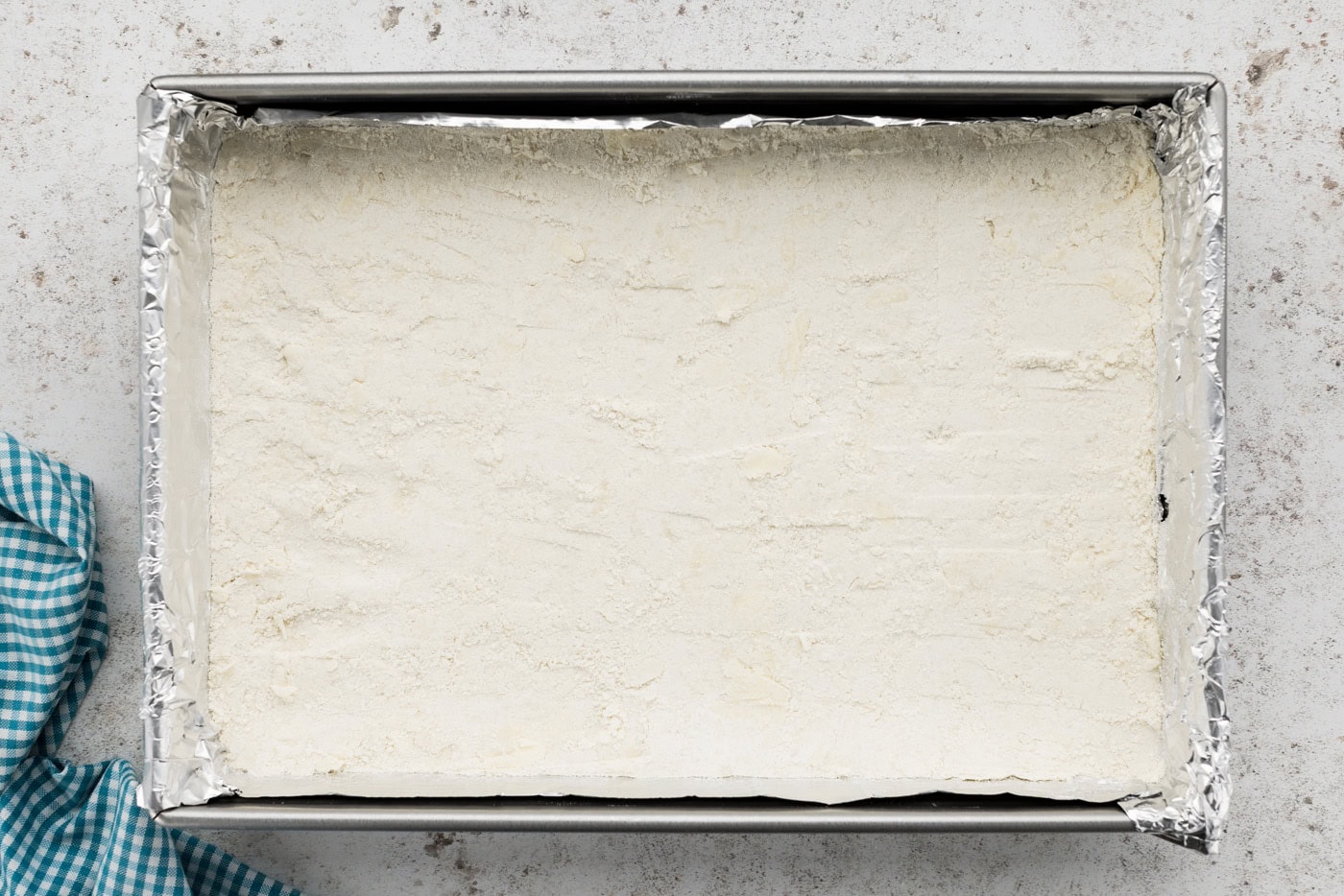 shortbread crust pressed on the bottom of a baking dish