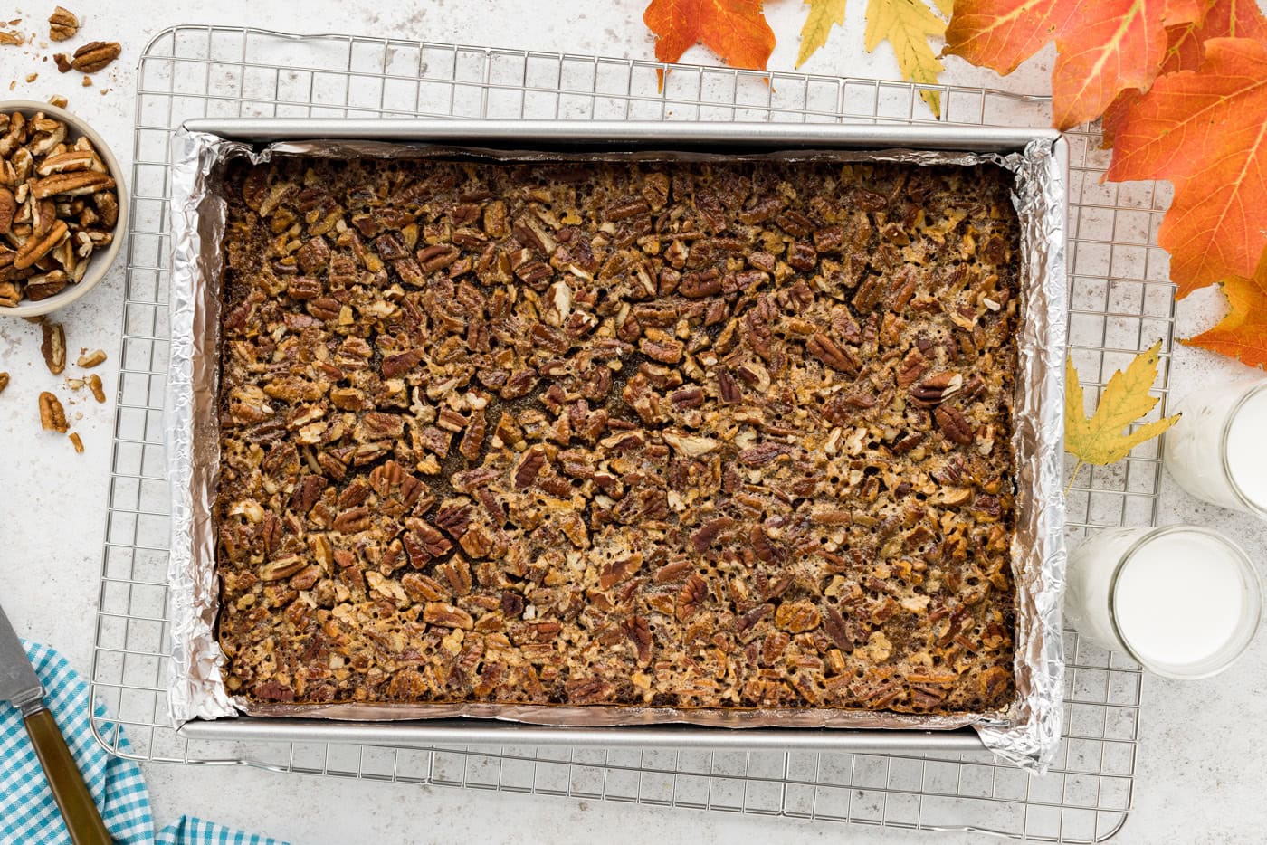 overhead photo of baked pecan pie bars in a dish