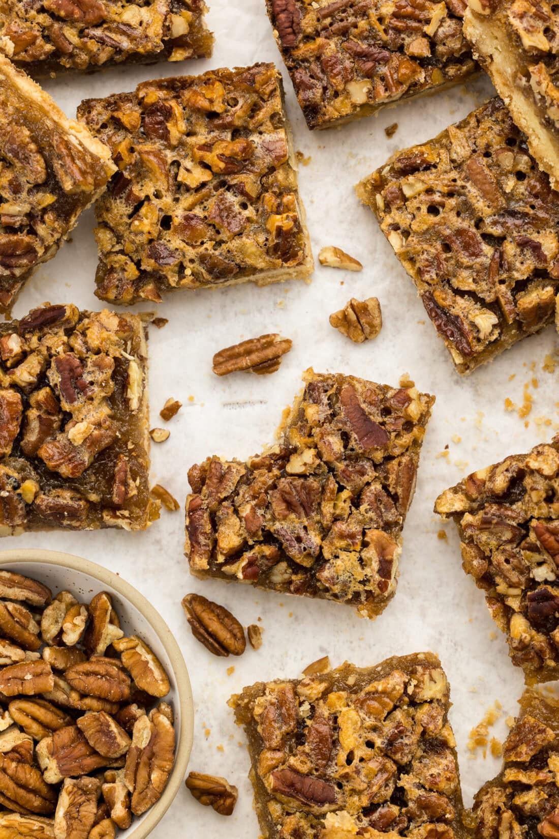 Overhead photo of Pecan Pie Bars with a bite taken out of one