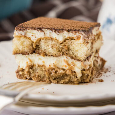 Close up photo of a slice of Tiramisu Icebox Cake on a plate