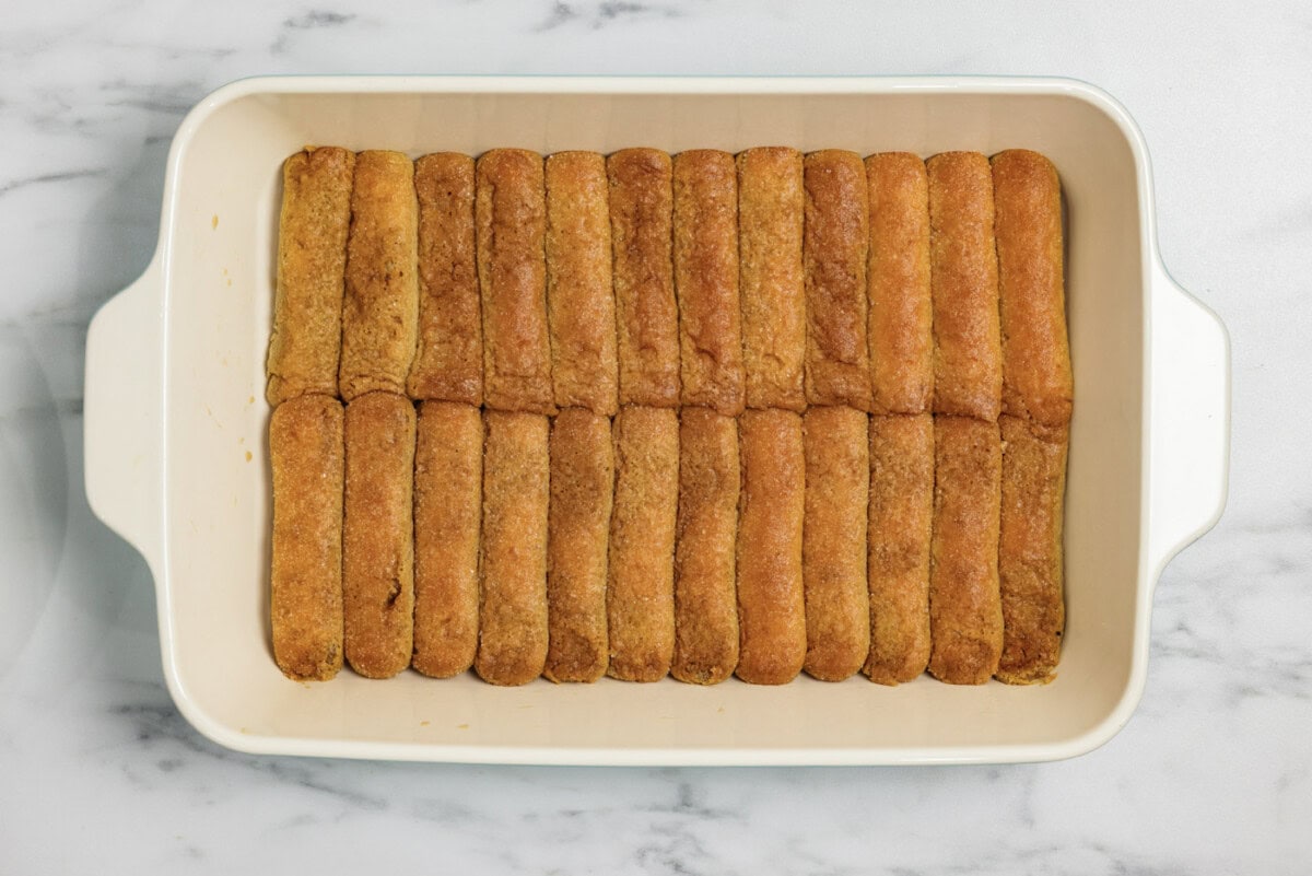 espresso dipped ladyfingers in a baking dish